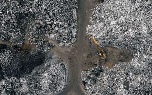 Aerial View Of Metal Recycling Facility With Backhoe Photo