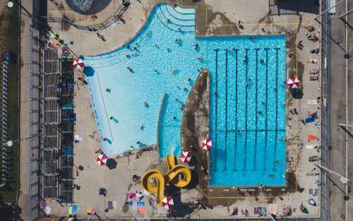 Aerial View Of Swimming Pool And Waterslides From Drone Photo