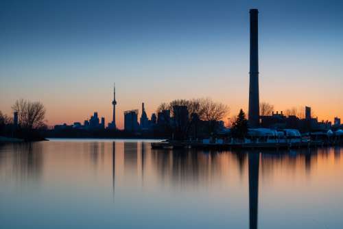 Toronto Skyline At Sunset Reflecting Into Waterfront Photo
