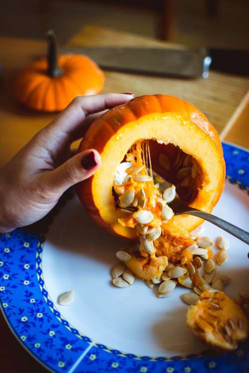 Carving Halloween pumpkin