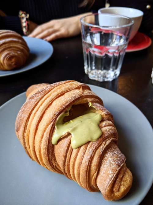 Pistachio croissant in a coffeeshop