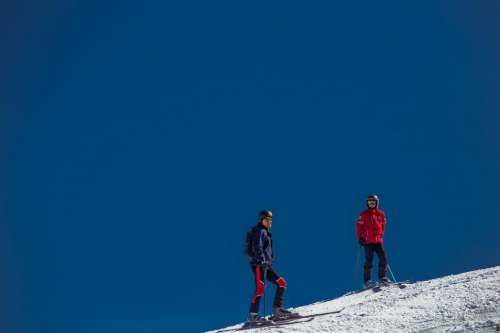 Two Skiers on ski runway
