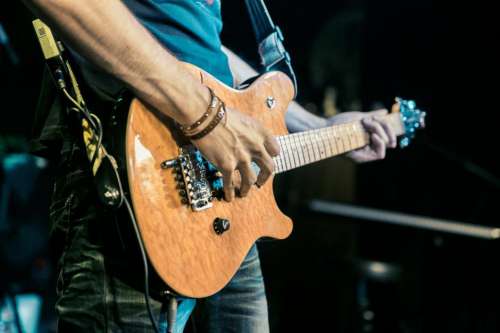 Guitarist playing guitar on stage