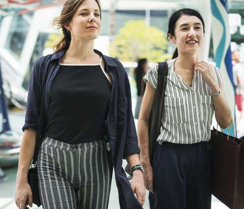 Two young women walking and shopping