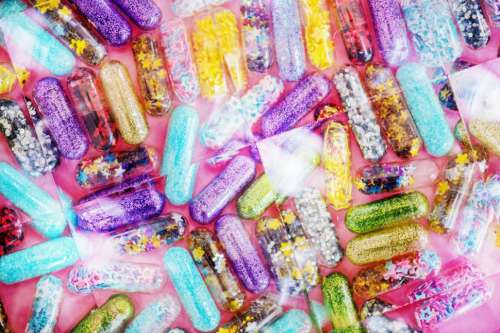 Close up of glitter pills- background