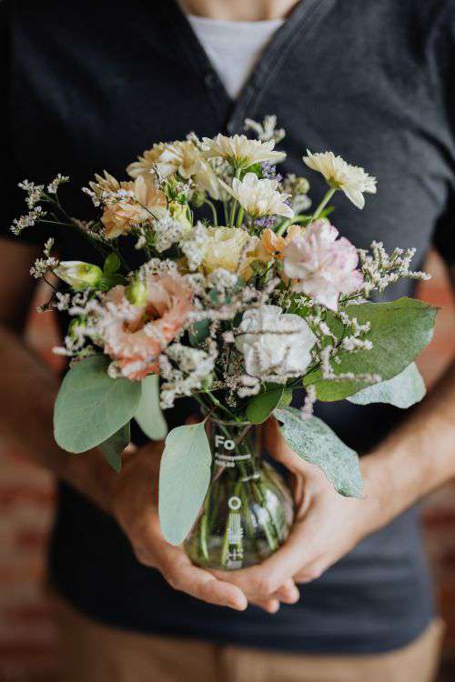 A small pastel bouquet in a glass vase