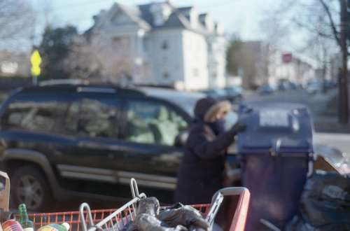 homeless city person cart trash