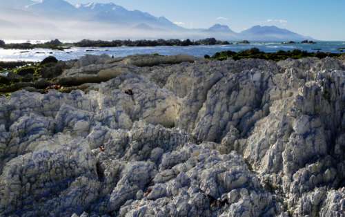 rocky coastline landscape mountains ocean