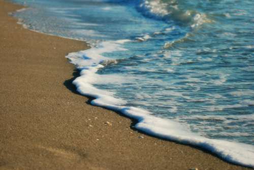 beach sand waves wet ocean