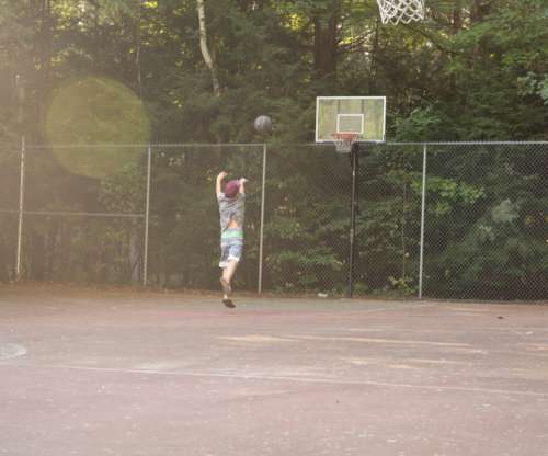 basketball game outdoors boy playing