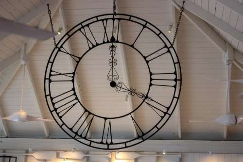 Stylish Analog Clock Hanging from the Roof