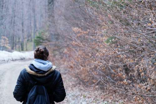 Girl Walking in the Forest on a Cold Weather