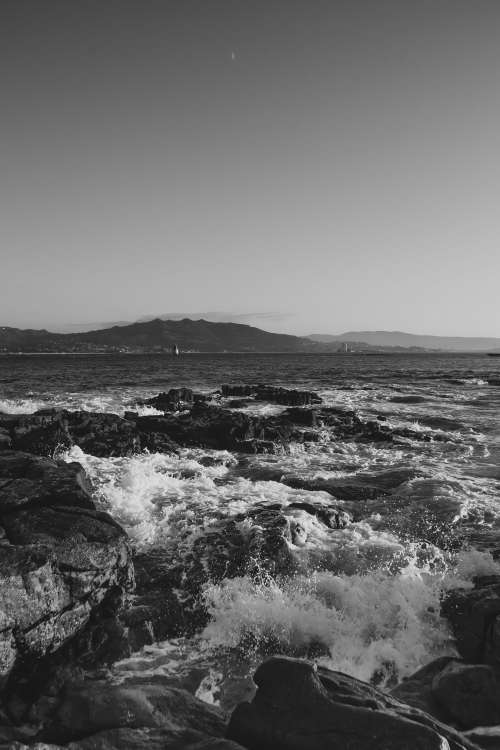 Black And White Waves On Rocks Photo