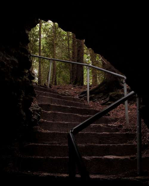 Dark Stony Stairwell Dips Into Cave Photo