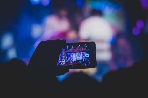 A Concert Seen Through An Audience Member's Mobile Phone Photo