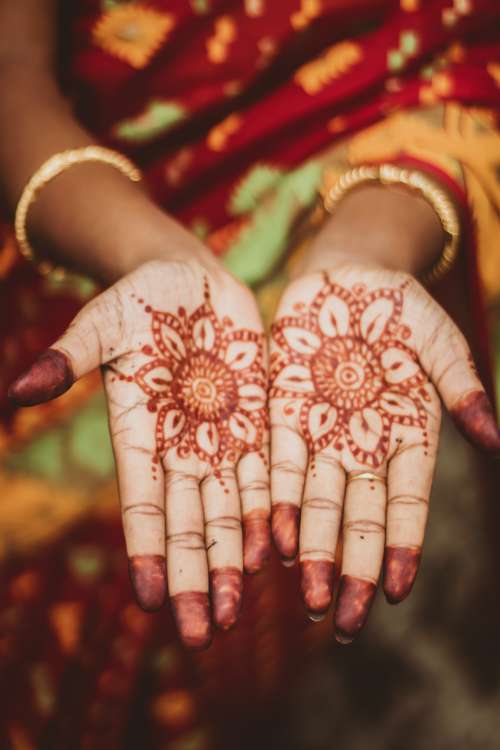 An Indian Woman In Robes Presents Henna-Painted Palms Photo