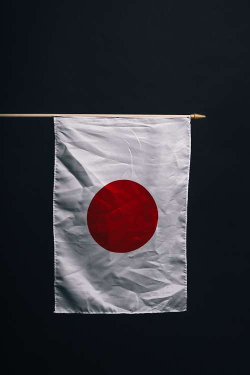 Japanese Flag Against Black Photo
