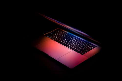 Laptop Glowing In The Dark Photo
