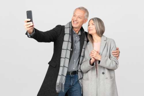 Middle Aged Couple Making A Selfie With Smartphone