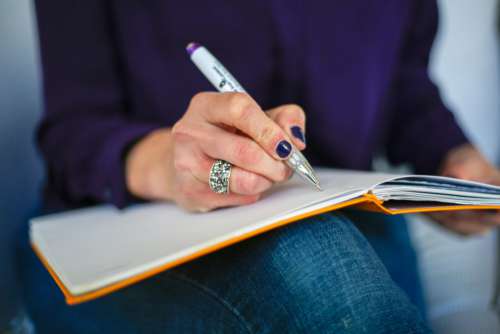 Woman Writing Notebook Free Photo