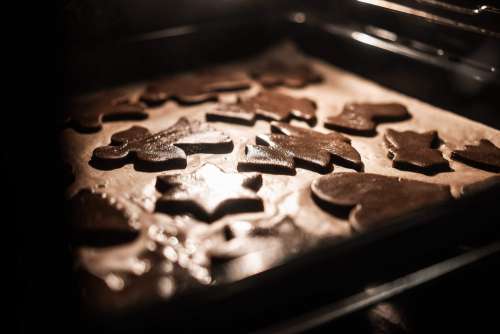 Baking Tray Full of Christmas Gingerbread Cookies Free Photo
