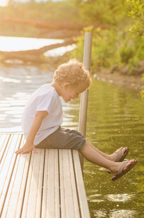 Dock Boy Water Sitting Playing Sun Lake Peaceful