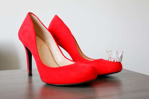 red heels shoes table crown