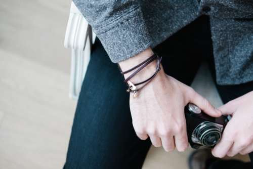 hands camera close up bracelet photographer