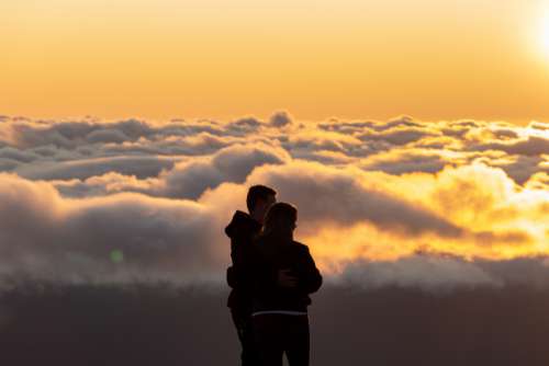 people silhouette outdoors couple clouds