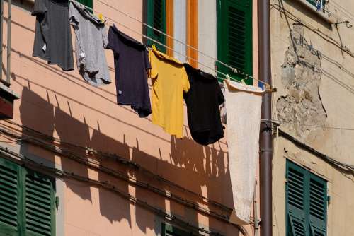 Clothes Left to Dry Hanging in Front of the Balcony