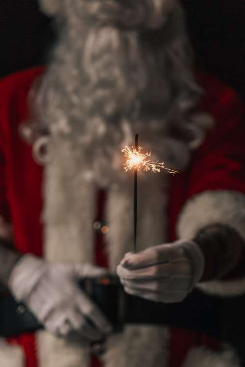 Santa Holds Up Sparkler Photo