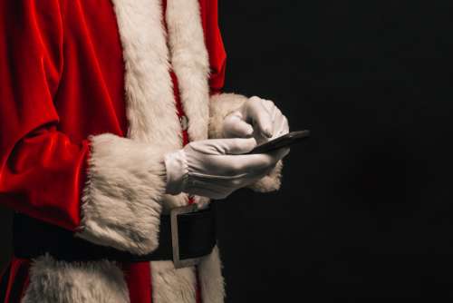 Santa Checks His Phone Photo