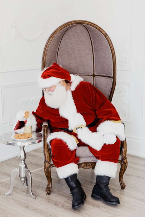 Santa Sits And Eats Photo