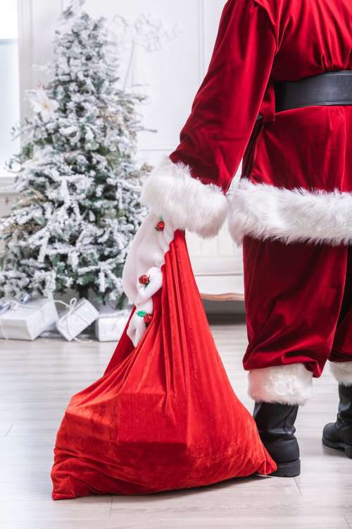 Santa Sets Down His Bag Of Toys Photo