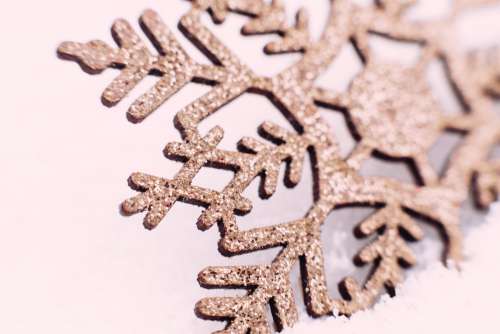 Gold glitter snowflake closeup