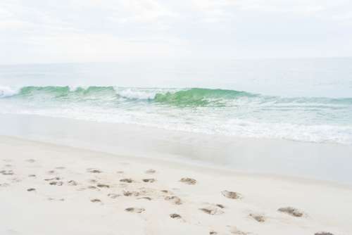 beach sand waves wet ocean