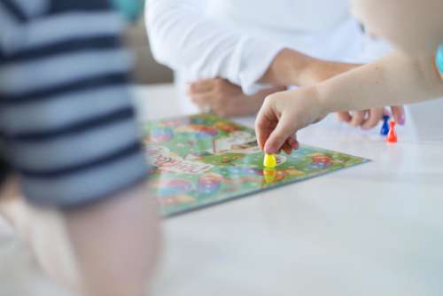 playing game kids table hands