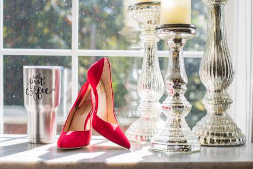 red heels shoes table fashion