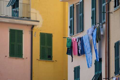 Clothes Left to Dry Hanging in Front of the Balcony
