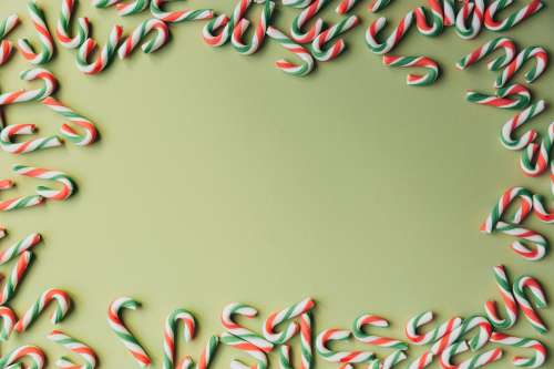 Candy Canes On Green Photo
