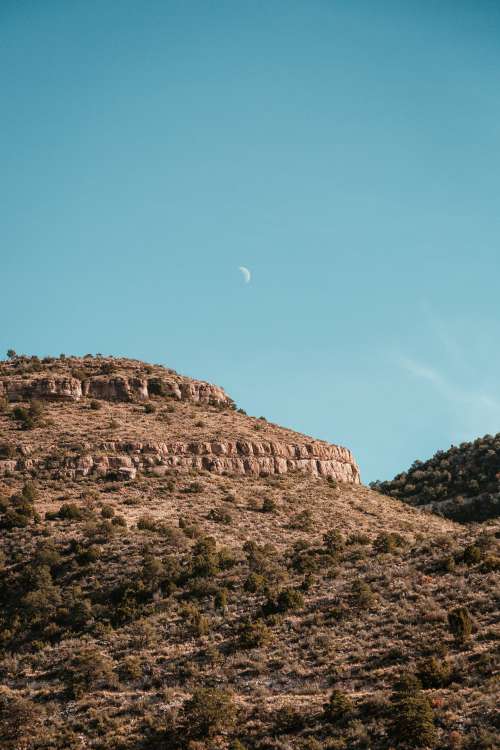 Daytime Moon And Rocks Photo