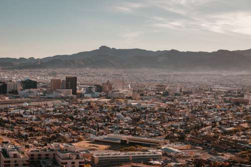 Large Mountains Surround A City Photo