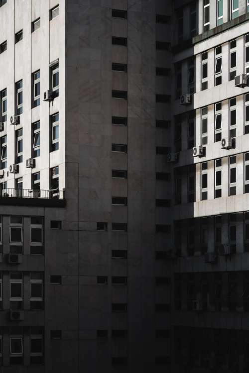 Exterior Walls Of Pristine Tall Building Covered In Windows Photo