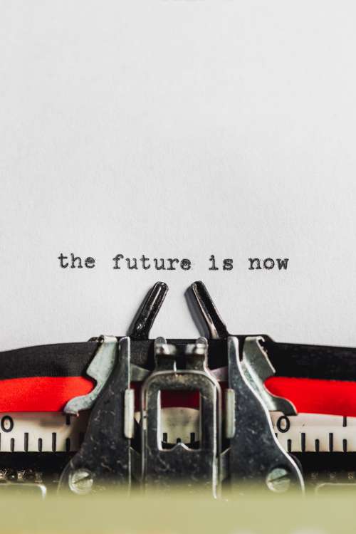 Text On Typewriter States The Future Is Now Photo