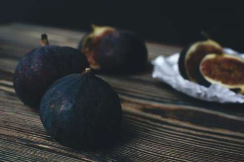 Fresh ripe figs on a wooden background
