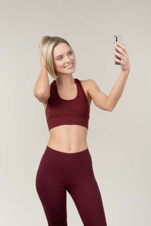 Young Woman In Sportswear Making A Selfie