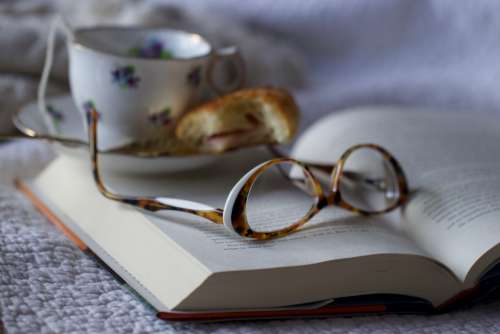 reading glasses book tea cup