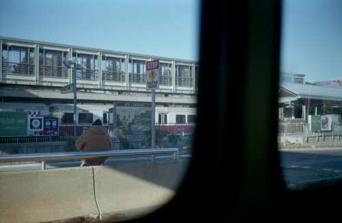 city man waiting metro bench