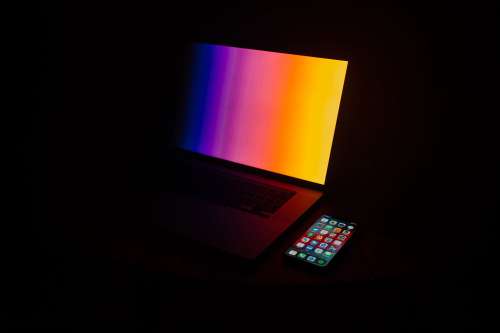 Illuminated Laptop and Mobile Phone Photo
