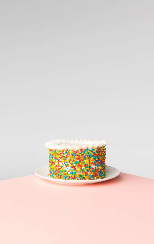 Celebration Cake On Pink Surface Photo